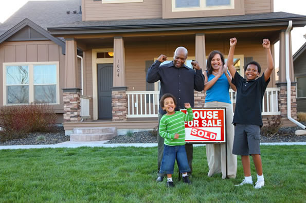 Family in front of a House
