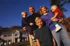 Family in front of home