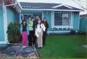 Family in front of home